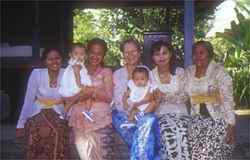 Robbi with 3 generations of women from the lovely family owned hotel that we stay at during the Bali Women's Retreat