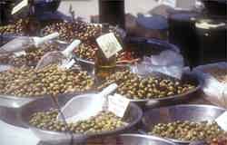 Olive stand in a colourful market - who can resist a little taste