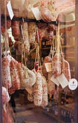 Salamis and other preserved meats tantalize the passer-by
